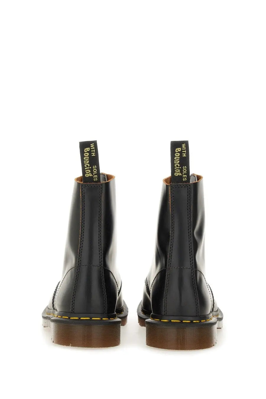 Black leather dr martens men’s vintage black boot showing the back side with sturdy sole and stitching details