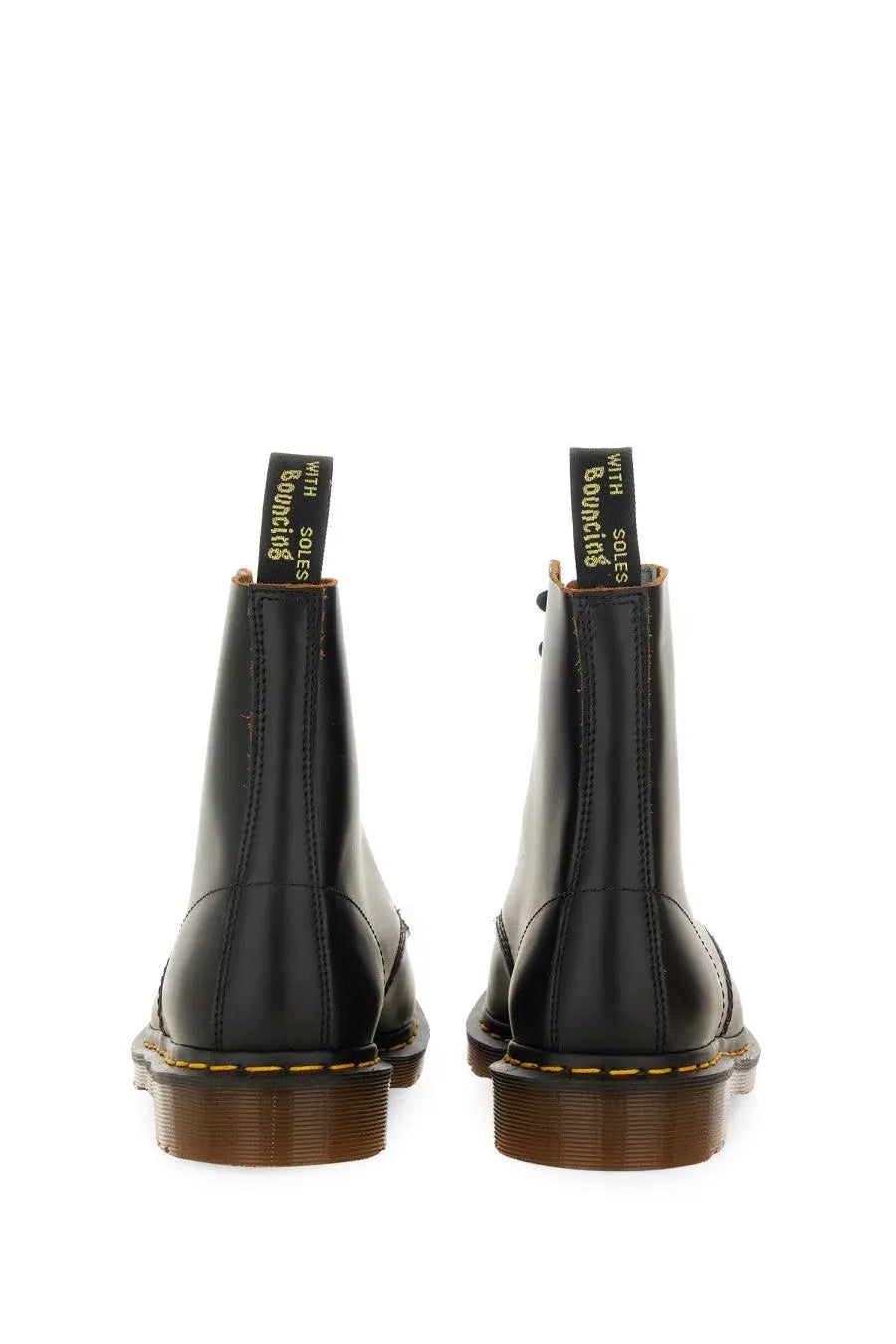 Black leather dr martens mens vintage black boot showing back side with classic stitching and heel loop