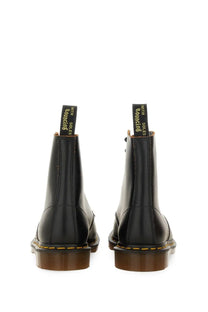 Black leather dr martens mens vintage black boot showing back side with classic stitching and heel loop
