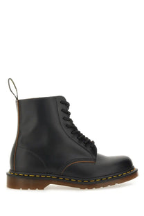 Black leather dr martens men’s vintage boot showing the back side with classic stitching and heel loop