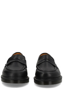 Black leather Dr Martens unisex mocassino Delapre penny shoe shown from the back side with classic penny loafer design