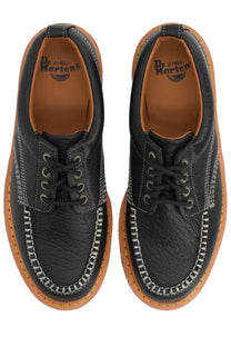 Black leather dr martens unisex mocassino lowell moc toe shoe showing the back side of the boot