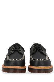 Black leather dr martens unisex mocassino lowell moc toe shoe showing front side with moccasin design
