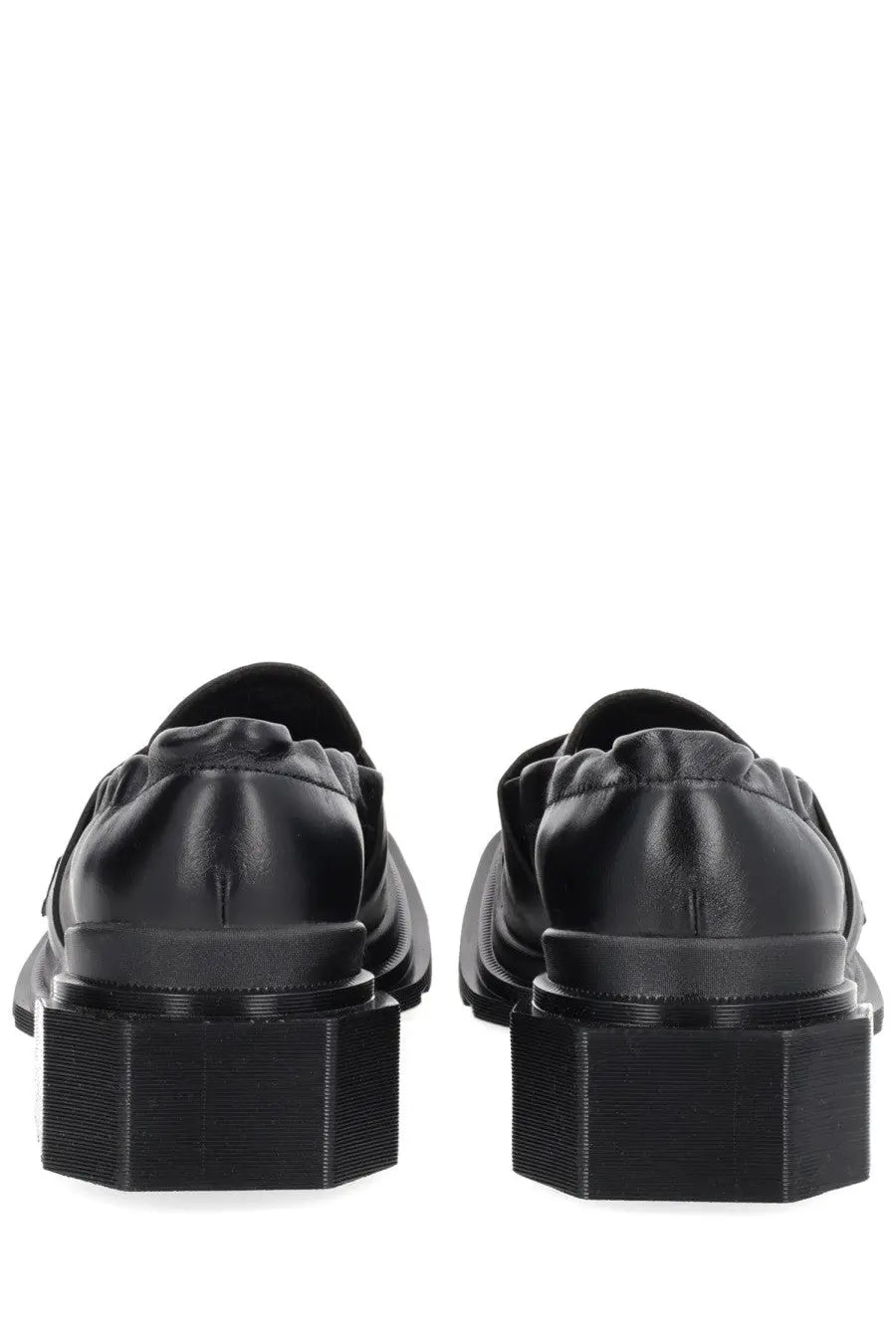 Dr martens women’s moccasin maybole black leather loafers with thick blocky soles shown from the back side