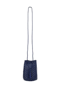 Dragon Diffusion women’s navy blue woven bucket bag with braided strap and tassel detail in tan and blue colors