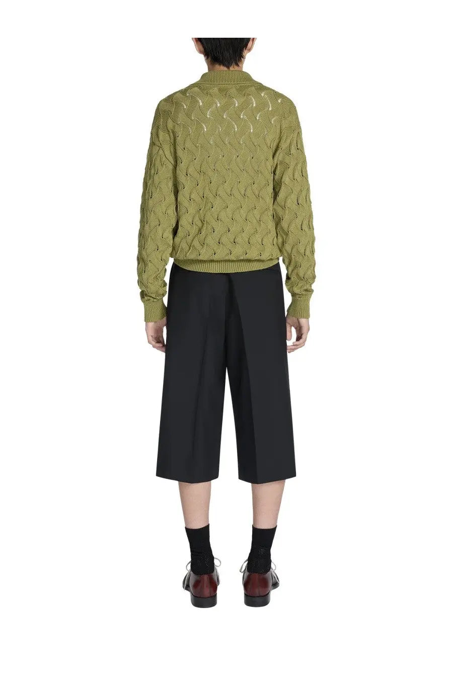 Olive green cable-knit sweater with ribbed cuffs and hem paired with dries van noten men’s black belted pants