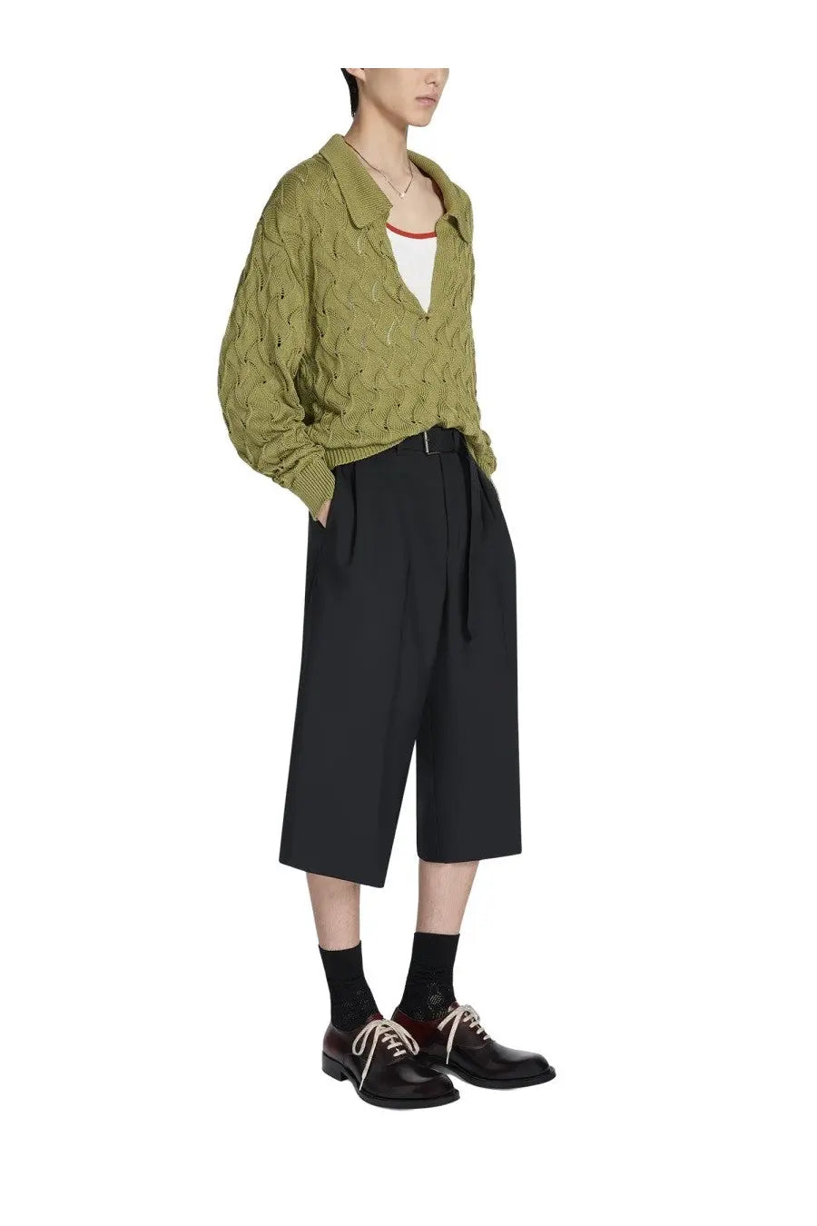 Olive green textured knit cardigan with collar and long sleeves paired with dries van noten men’s belted black pants