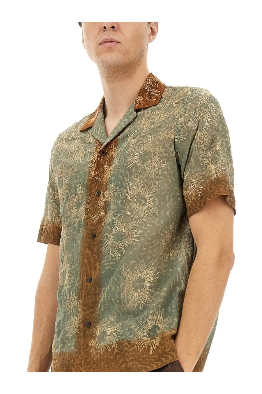 A men’s short-sleeved olive green Dries Van Noten boxy fit shirt with gold floral pattern and brown collar accents