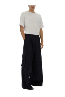 Dries Van Noten men’s black wide-leg cargo pants with large side pockets and a relaxed modern silhouette
