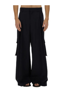 Black wide-leg cargo pants by dries van noten with large side pockets and structured waistband for men