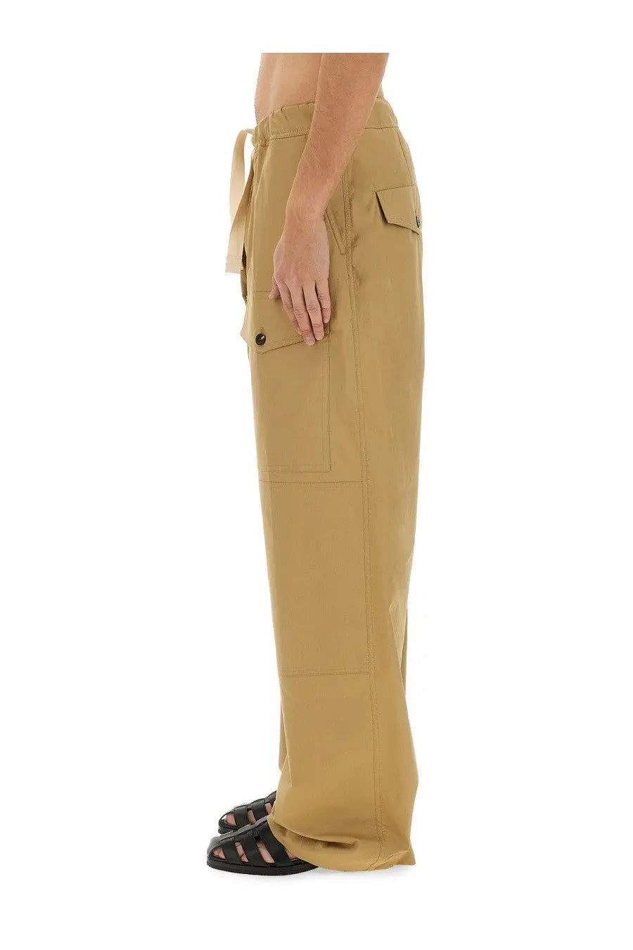 Tan cotton cargo pants by dries van noten with drawstring waist and multiple flap pockets for men in beige