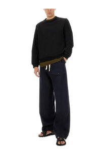 Black wide-leg cotton trousers by dries van noten with a drawstring waist and side pockets for men