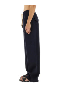 Dark navy cotton wide-leg trousers with elastic waistband and side pockets by dries van noten men’s pants