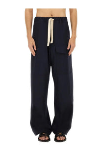 Dark navy wide-leg cotton pants with drawstring waist and front pockets by dries van noten for men
