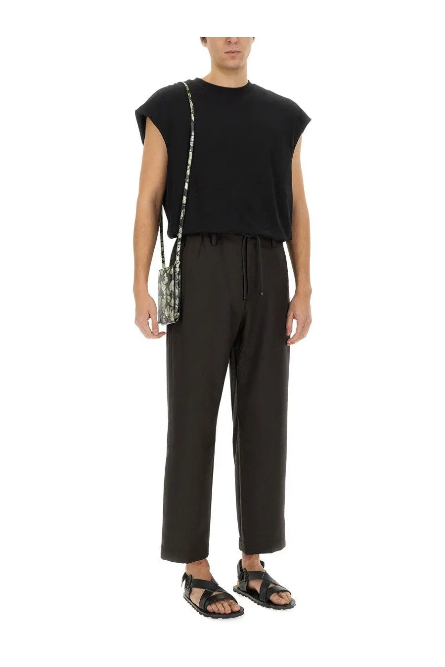 Black shoulder bag with snakeskin pattern and thin strap paired with dries van noten men’s black cotton shirt