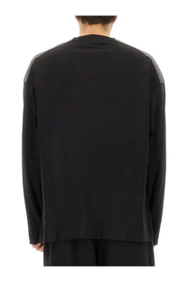 Dries van Noten men’s black cotton sweatshirt with gray panel accents on the shoulders and long sleeves