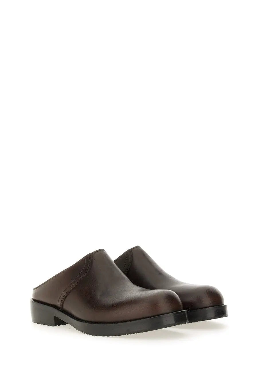 Dark brown leather mules with low block heel and minimalist design from dries van noten men’s leather clogs brown