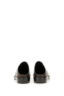 Dries Van Noten men’s brown leather mules with glossy finish and black rubber soles front view