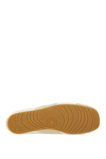 White canvas dries van noten men’s sneaker with tan rubber sole concentric tread and embossed logo center