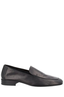 Black leather loafer with sleek minimalist design and low block heel from dries van noten mens mocassino in pelle black