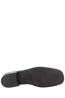 Black rubber sole with circular embossed logo near the heel of dries van noten men’s mocassino in pelle black