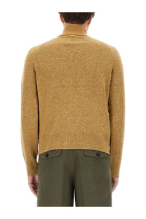 Dries Van Noten men’s mutated shirt beige shown as a warm mustard-yellow turtleneck sweater with ribbed cuffs