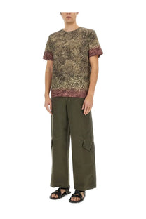 Dries Van Noten men’s regular fit short-sleeved t-shirt with textured swirling pattern in earthy tones and burgundy hem