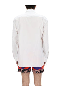 Dries Van Noten men’s white long-sleeved button-up shirt with a crisp tailored fit in cotton fabric
