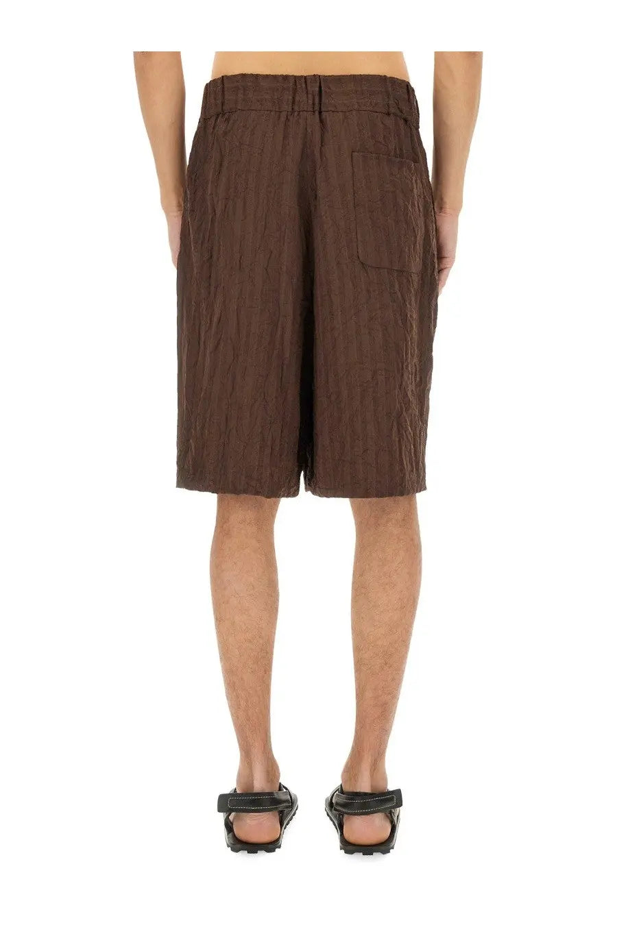 Brown textured pleated shorts with relaxed fit and single side pocket by dries van noten for men