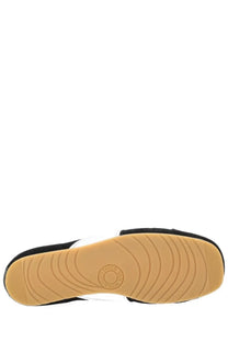 Dries Van Noten men’s black suede slip-on sneaker with tan rubber sole and concentric circular patterns