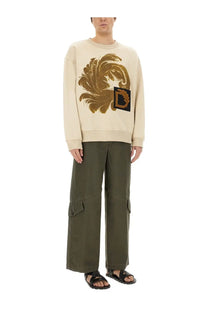 Dries Van Noten men’s beige sweatshirt with cream fabric gold embroidered floral design and black appliqued d patch