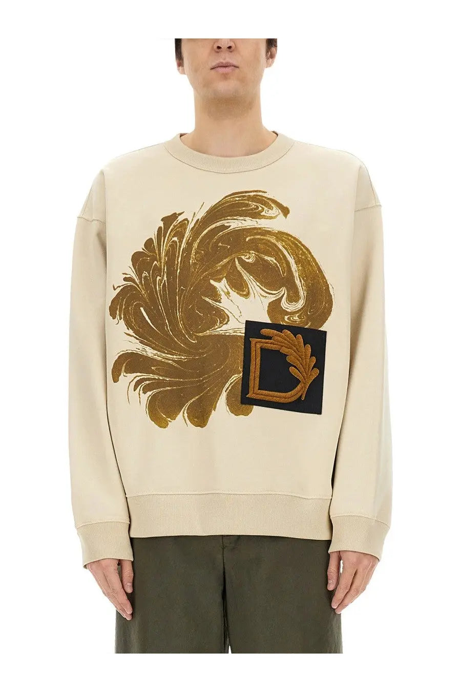 Cream-colored Dries Van Noten men’s sweatshirt with gold marbled floral graphic and embroidered black patch logo