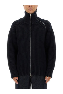 Dries Van Noten men’s black ribbed wool sweater with high collar and silver zippered front closure