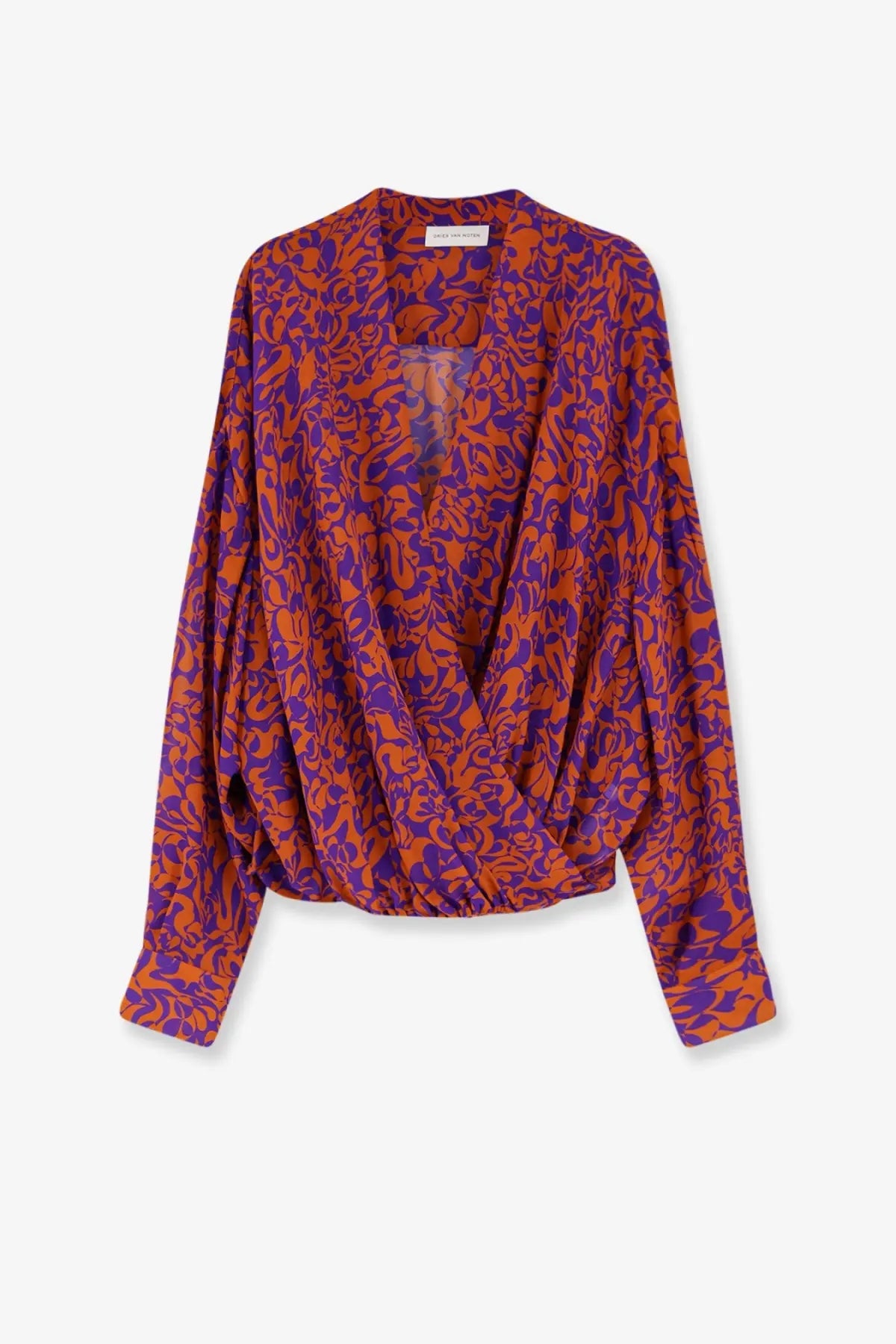 A vibrant orange and purple floral-patterned silk blouse with a draped asymmetrical front by dries van noten