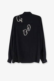 Back of dries van noten women’s casia black satin shirt with white embroidered floral and circular motifs