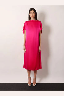 A vibrant fuchsia satin midi dress with a loose flowing silhouette and cape sleeves by dries van noten
