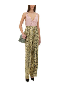 Dries Van Noten women’s jacquard high-waisted wide-leg pants with gold and brown snake print pattern