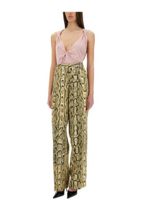 Snake-print wide-leg trousers in shimmering gold and olive green pattern complementing dries van noten blue jersey top