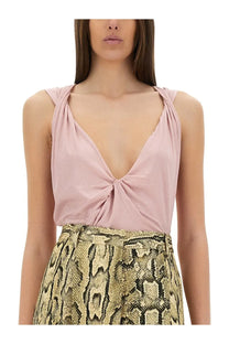 Dries Van Noten women’s soft pink sleeveless jersey top with deep v-neck and twisted fabric detail at center