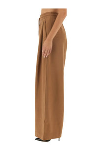 Cropped wide-leg camel brown jogging pants for women by Dries Van Noten with elastic waistband and flowing fabric