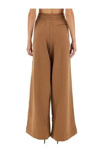 Back view of dries van noten women’s brown jogging pants with tan wide-leg elastic waistband and single back pocket