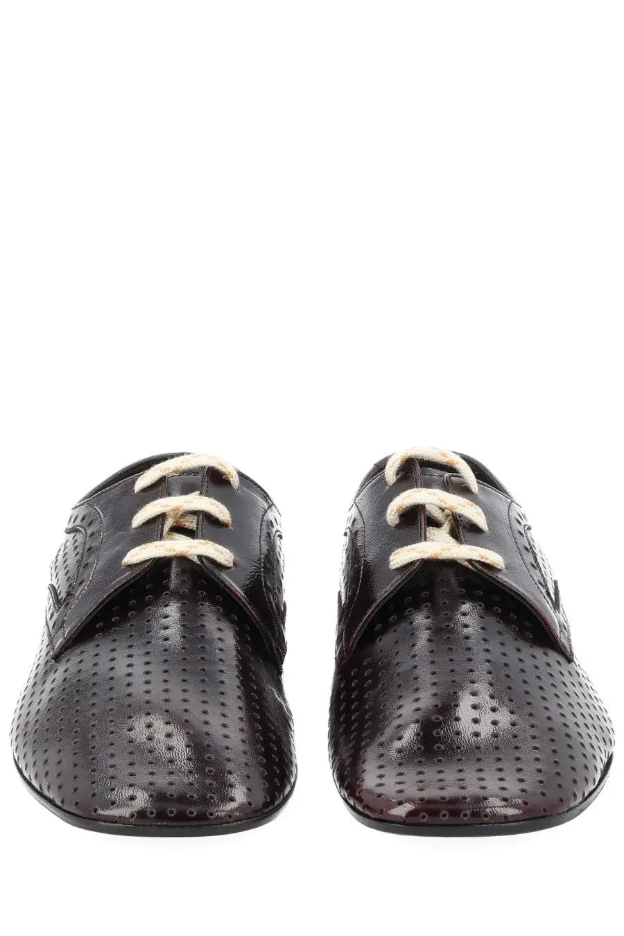 Black patent leather lace-up oxford shoes with perforated detailing and cream-colored laces for women
