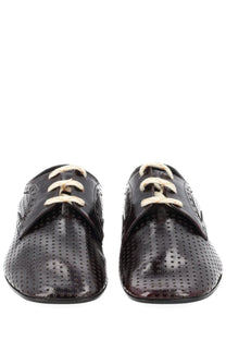 Black patent leather lace-up oxford shoes with perforated detailing and cream-colored laces for women