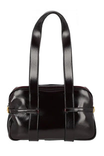 Black patent leather satchel with gold-tone hardware and dual top handles for stylish everyday use