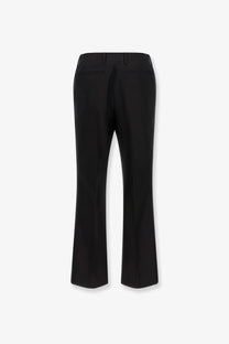 Black tailored trousers with a straight-leg cut and subtle back pleats made from wool and silk by dries van noten