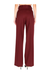 Burgundy high-waisted wide-leg Dries Van Noten pants with sleek tailored fit and subtle back pleats for women