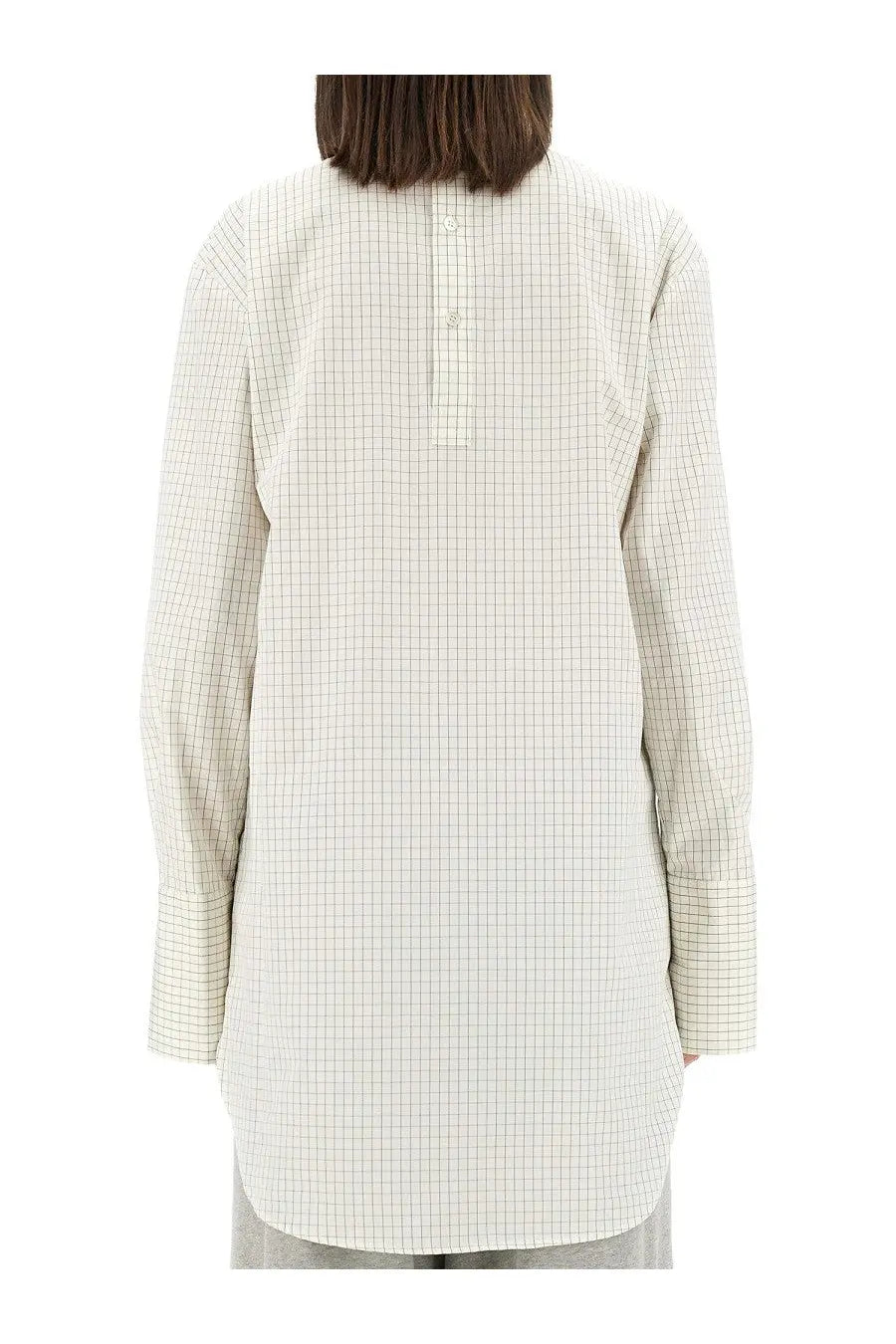 Dries van noten women’s plaid shirt white showing back button closure on long-sleeved off-white blouse with grid pattern