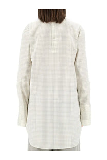 Dries van noten women’s plaid shirt white showing back button closure on long-sleeved off-white blouse with grid pattern