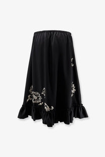 Dries Van Noten women’s black midi skirt with delicate white floral embroidery and ruffled hem detail