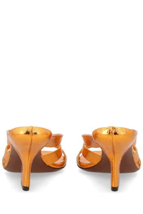 Dries van noten women’s orange metallic heels with sleek crisscross straps and polished finish visible from the back